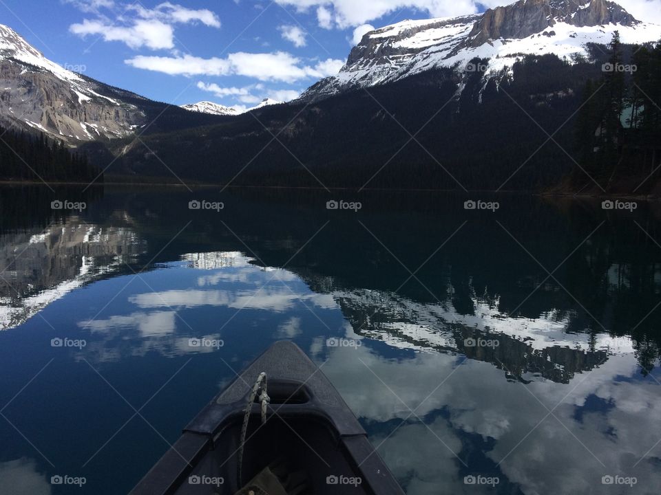Rocky mountain reflecting on emerald lake