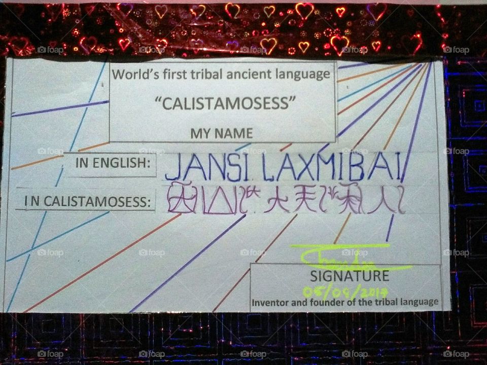 the world's famous name and INDIAN freedom fighter JANSI LAXMIBAI, is written in the world's first ancient tribal language in the CALISTAMOSESS.
