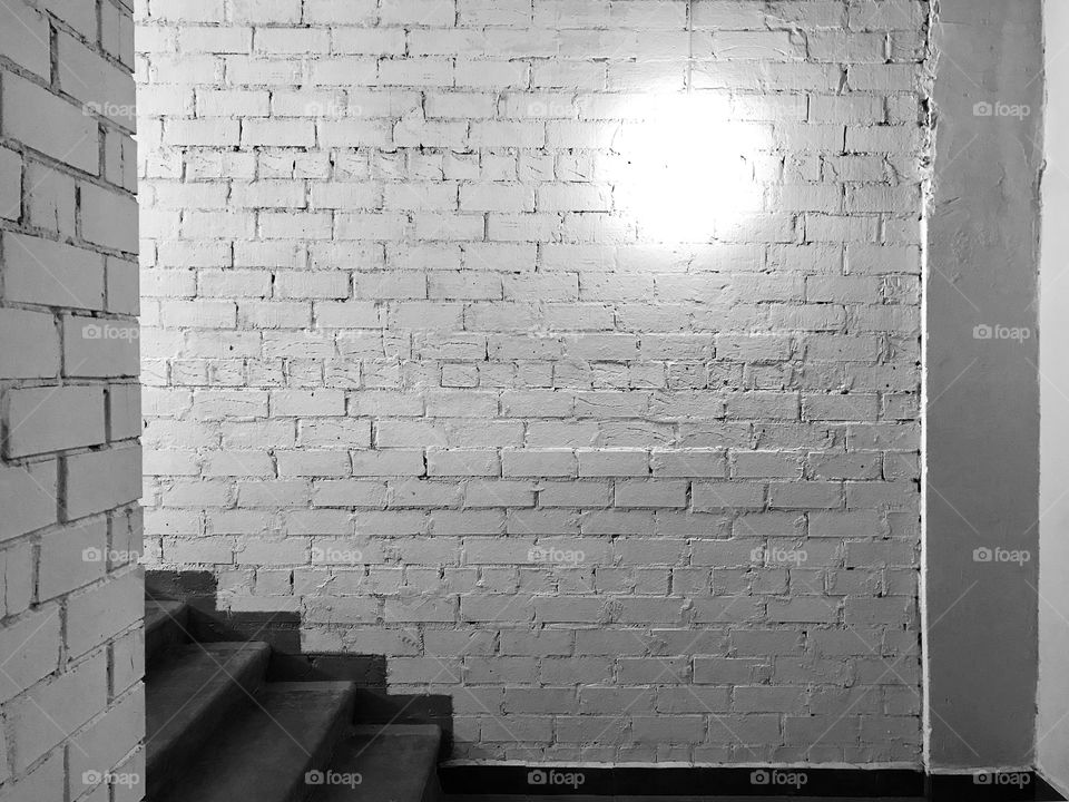 Brick white wall with stairs