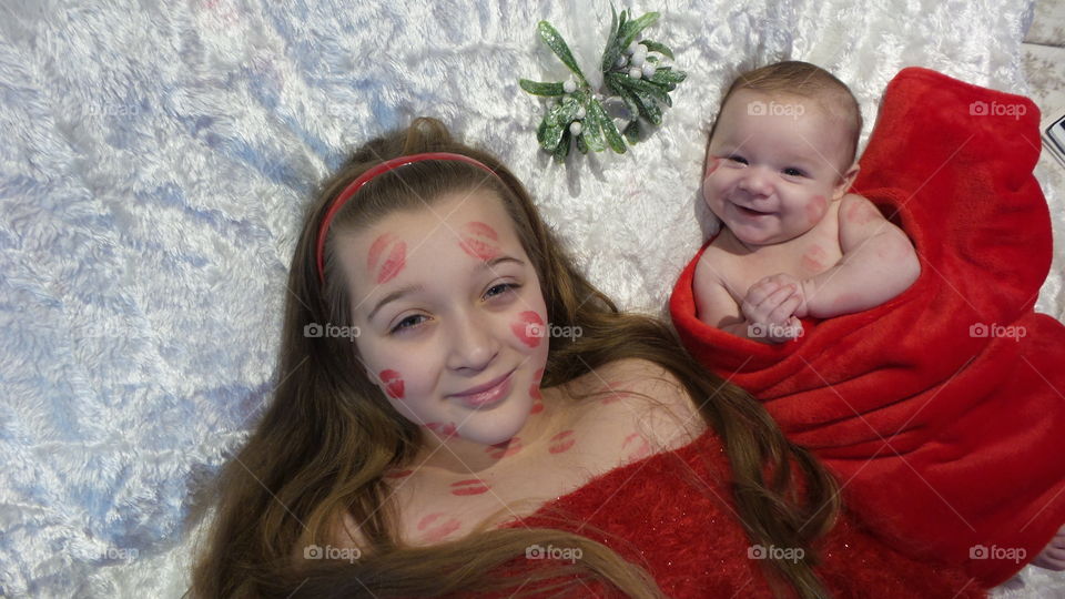 Children under the mistletoe with model releases