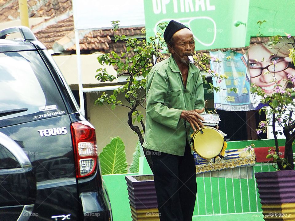 it's a hard day. he is trying to entertain the drivers at the cross road