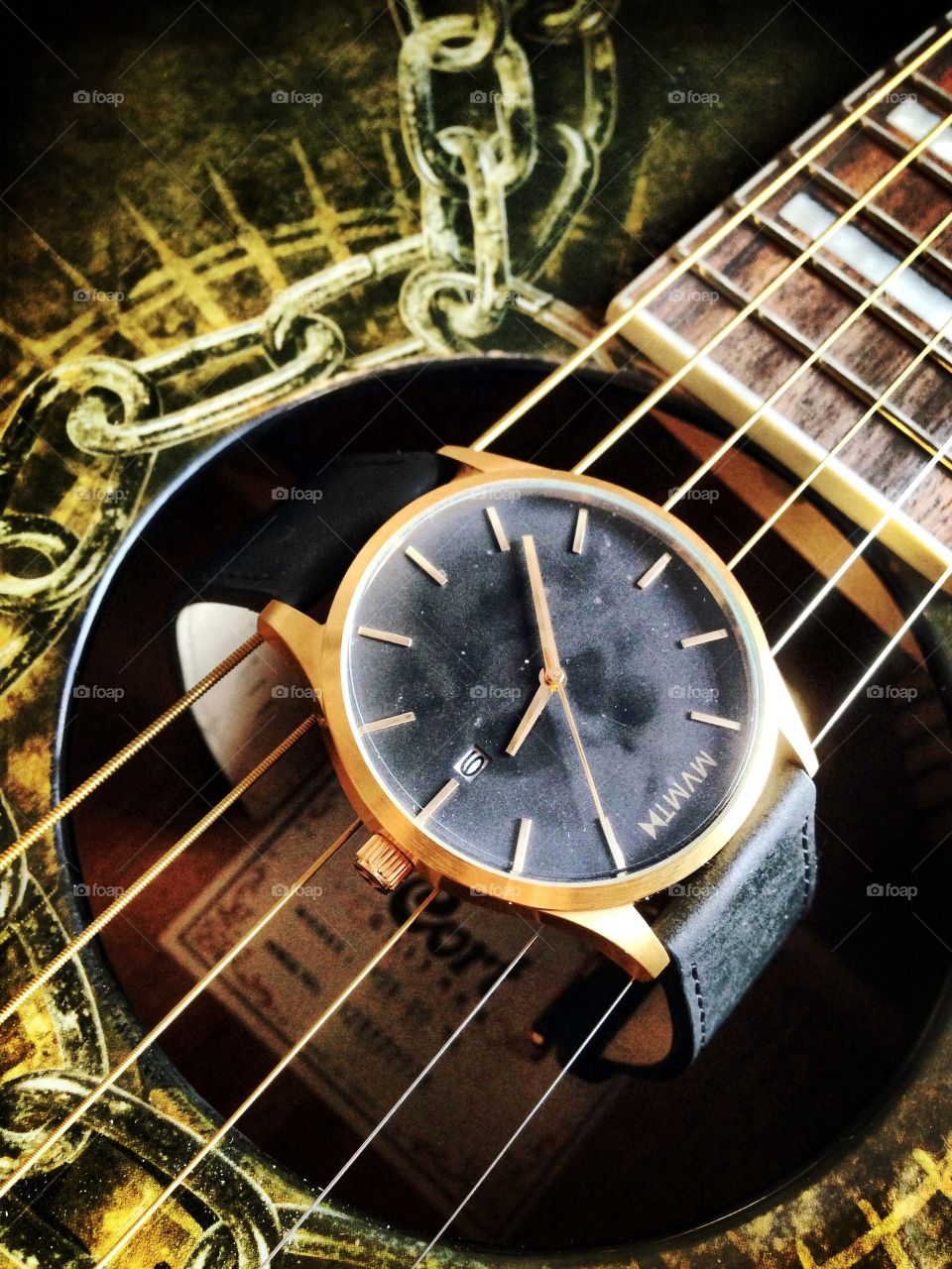 Time and music . Movement watch on the guitar 