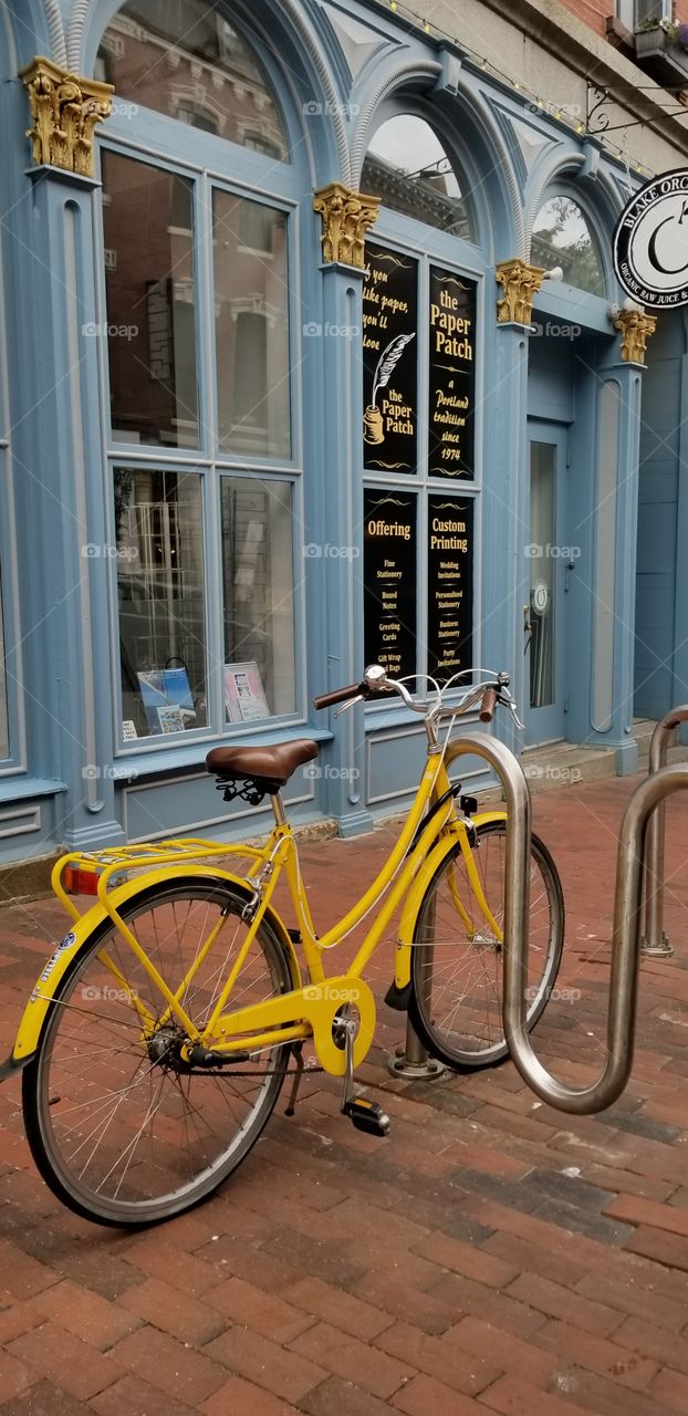 Yellow Bicycle on a brick road