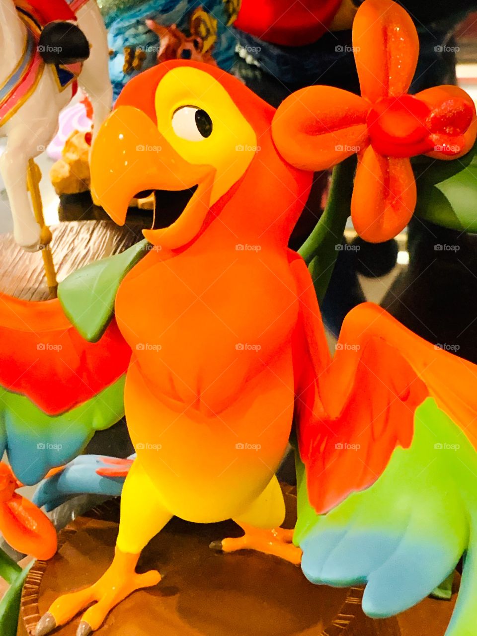 Brightly colored comic parrot and flower