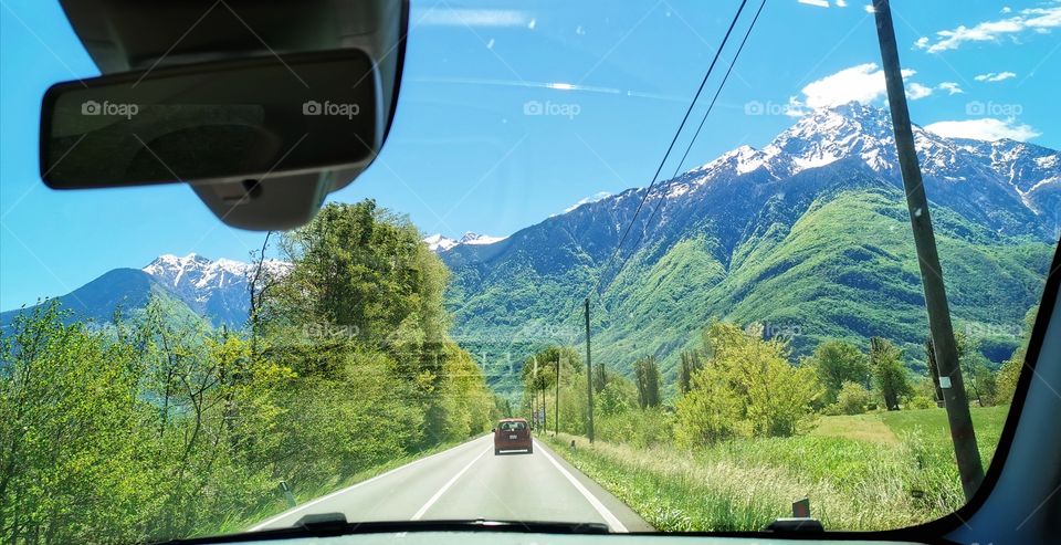 Road trip traveling in a long holiday with beautiful countryside mountain view in Italy.