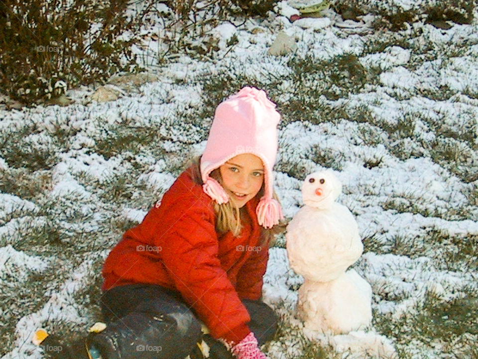 Pretty Little Snowman- she loves the snow and was determined to make a snowman no matter how small. 