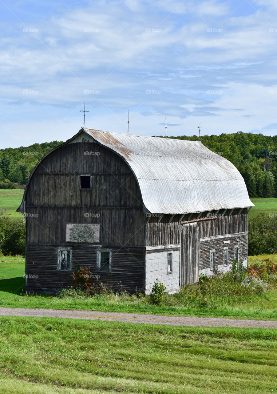 Rustic Barn On Sunny Summer Day