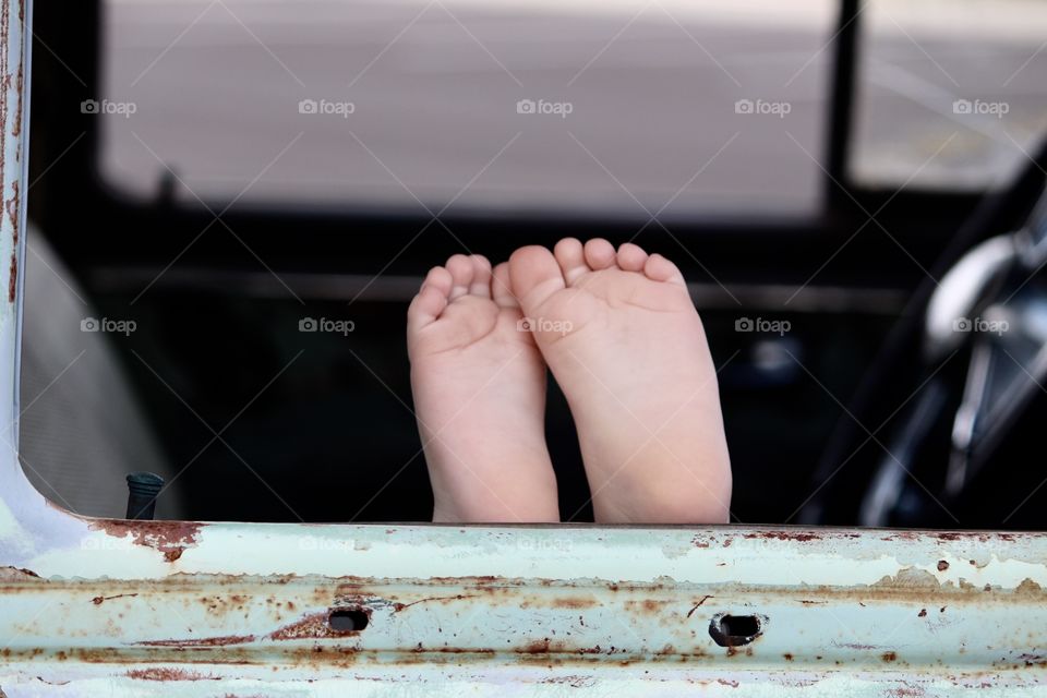 Tiny Feet Out the Car Door Window 