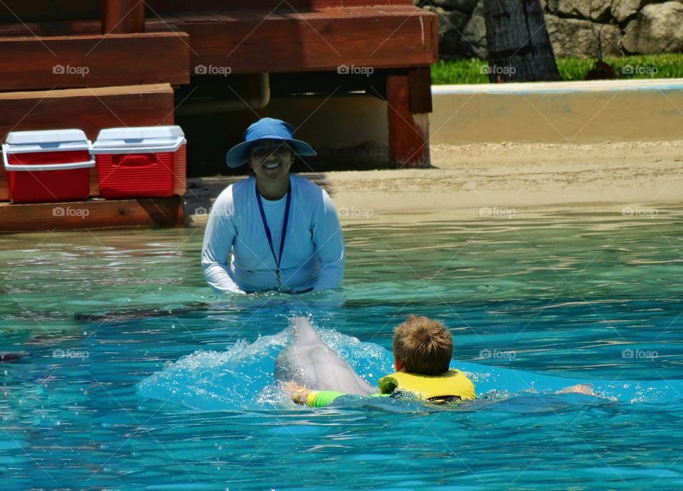 Child Riding A Dolphin
