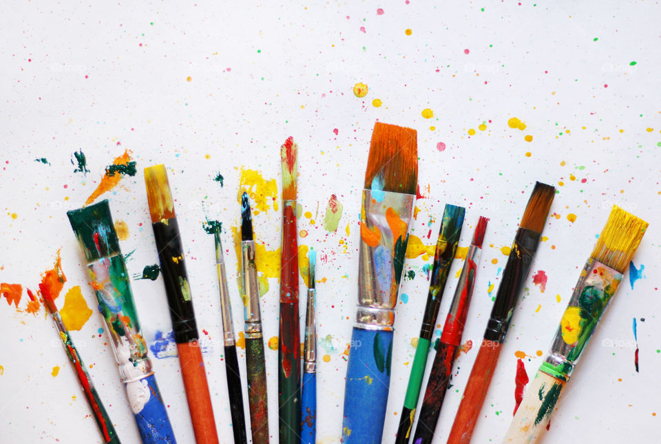 Colorful painted paintbrushes background 2