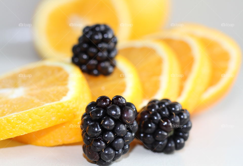 Orange slices and blackberries
