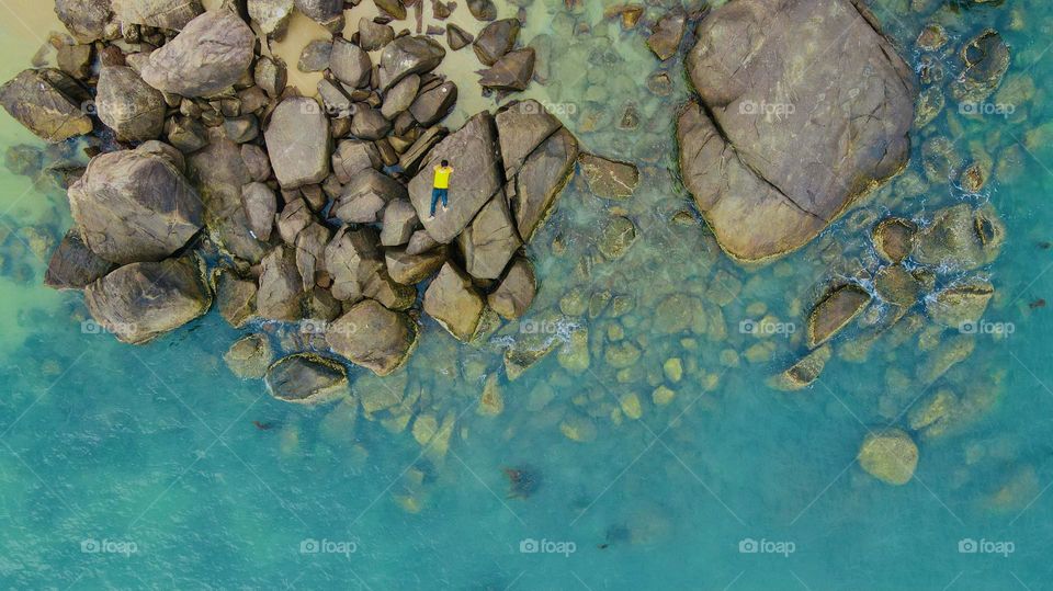 Clear water stones beach in summer 