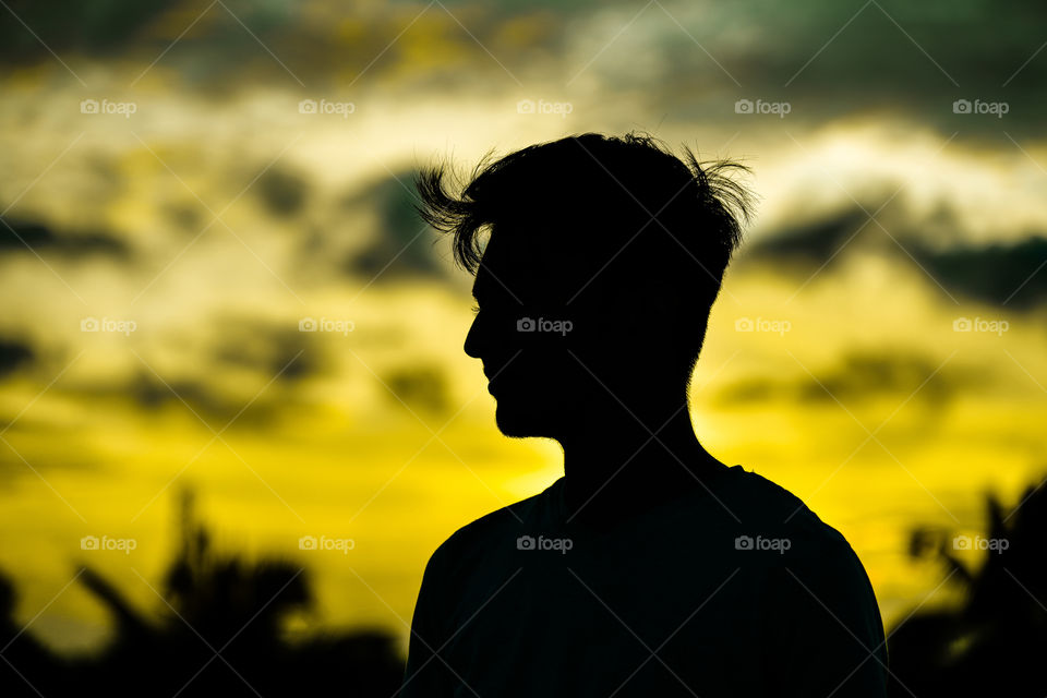 A cute smile in an dark shadow