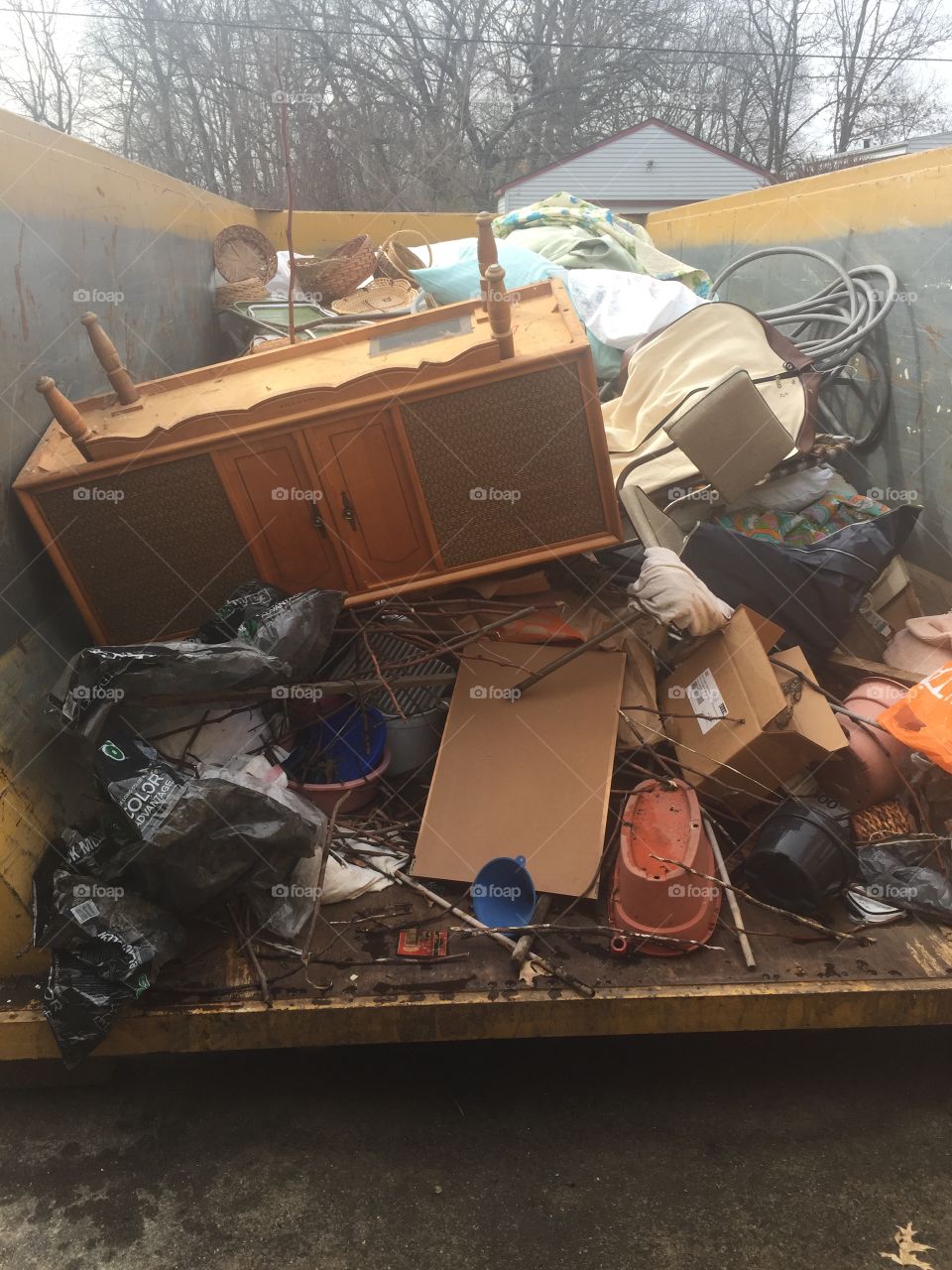 Picture of contents of dumpster after emptying moms house when she moved to an apartments 