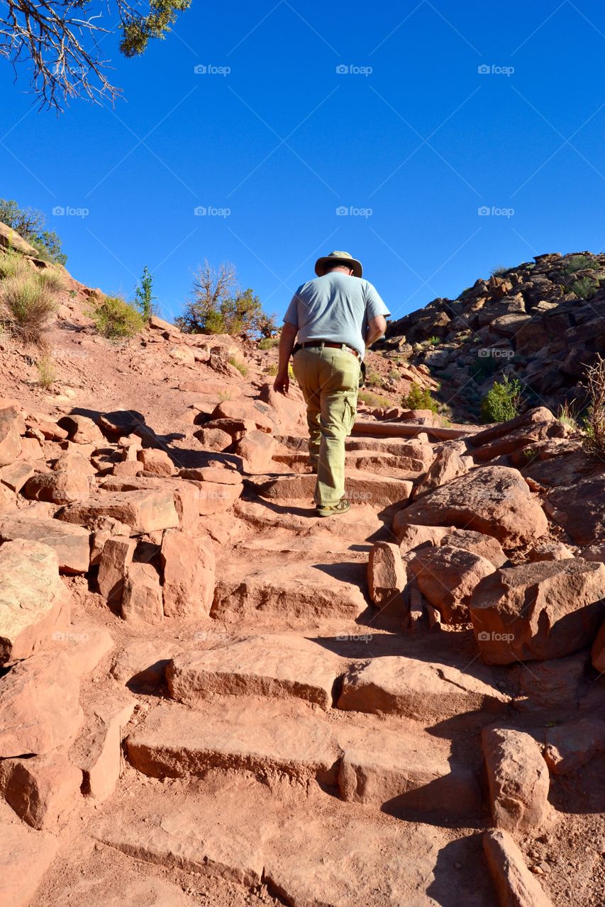 Man Climbing Desert Steps