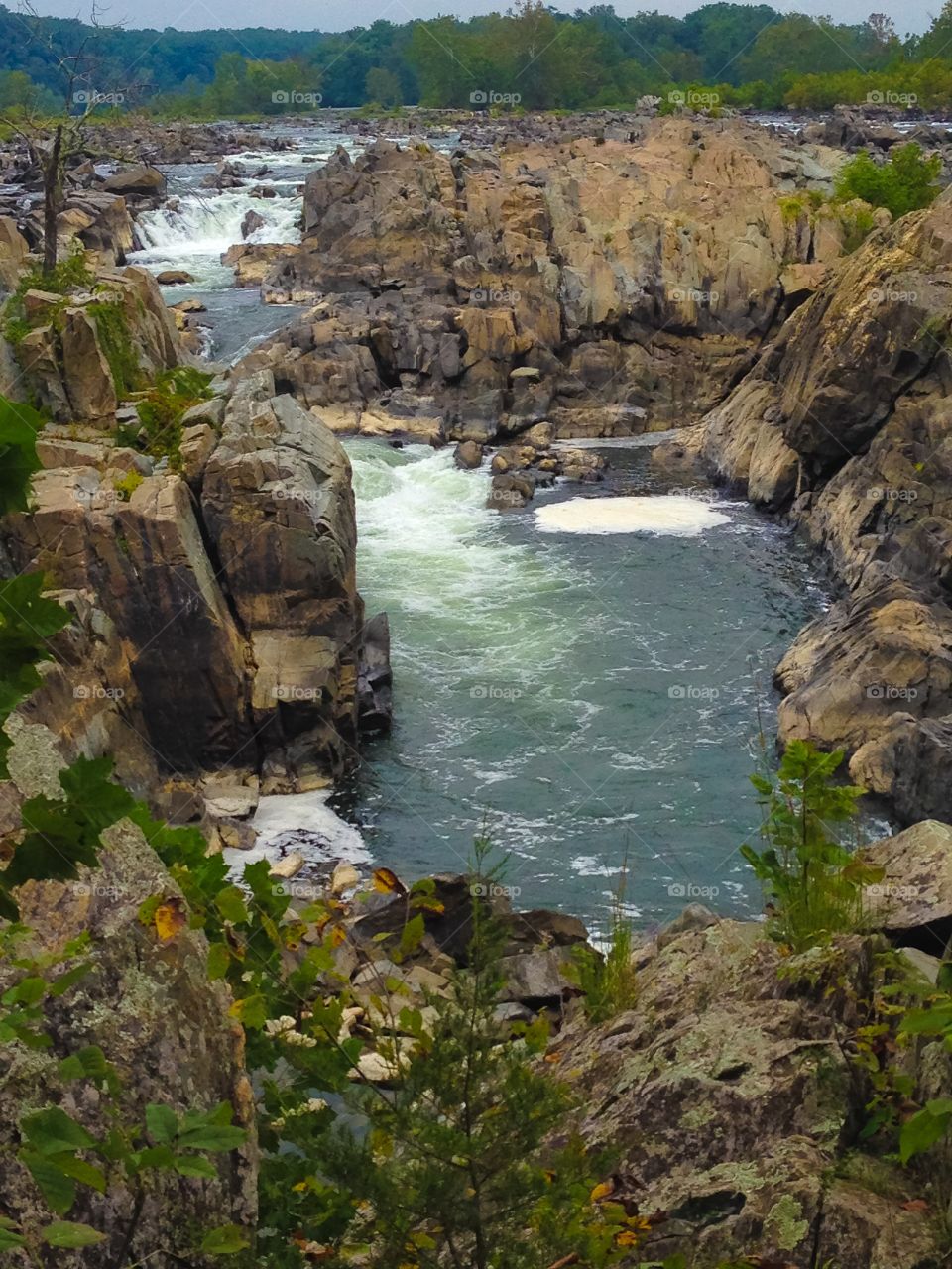 Scenic view of waterfall and rocks