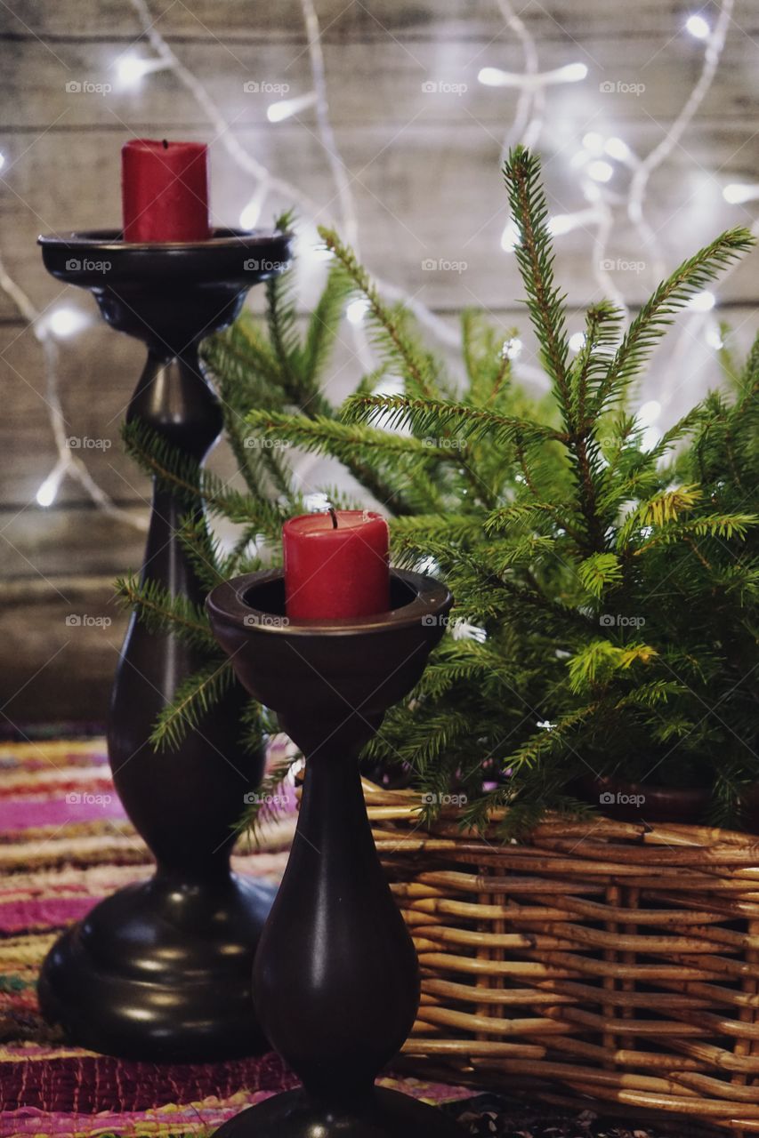 Candle candlestick branch spruce garland lights christmas decoration celebration close-up wood background still_life