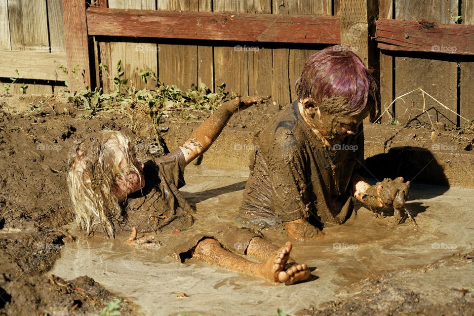 Boys Playing In Mud