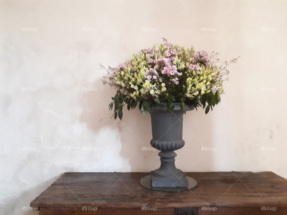 Vase with flowers at the table