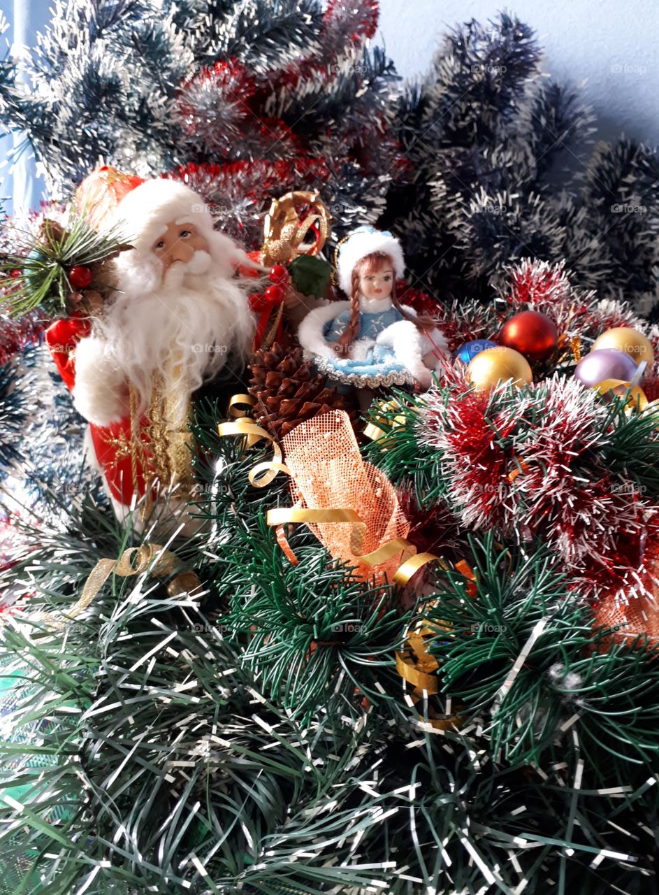 Kukli Santa Claus and snow maiden under the tree