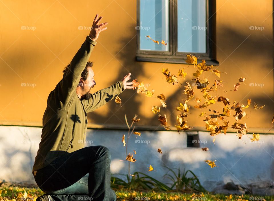 Throwing autumn leaves