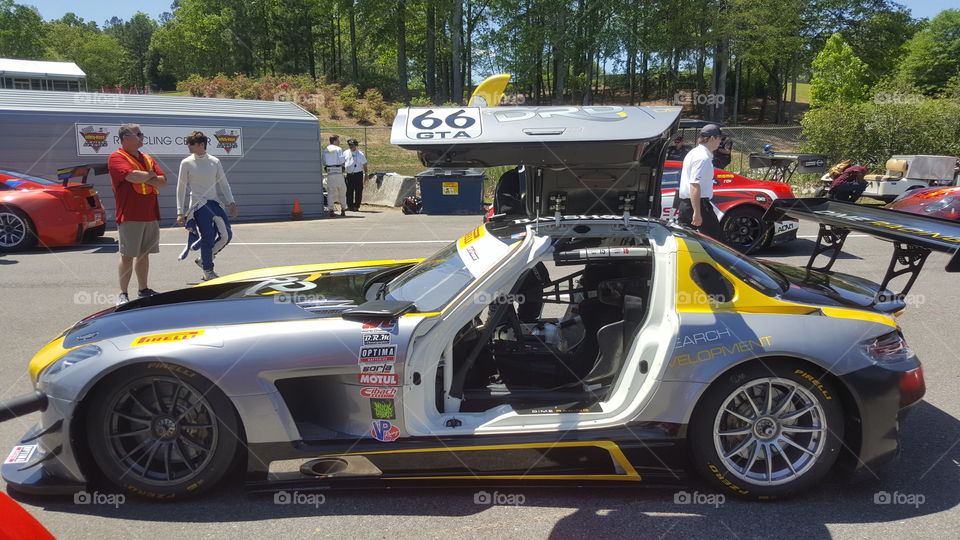 A racecar with gullwing doors ready to fly.