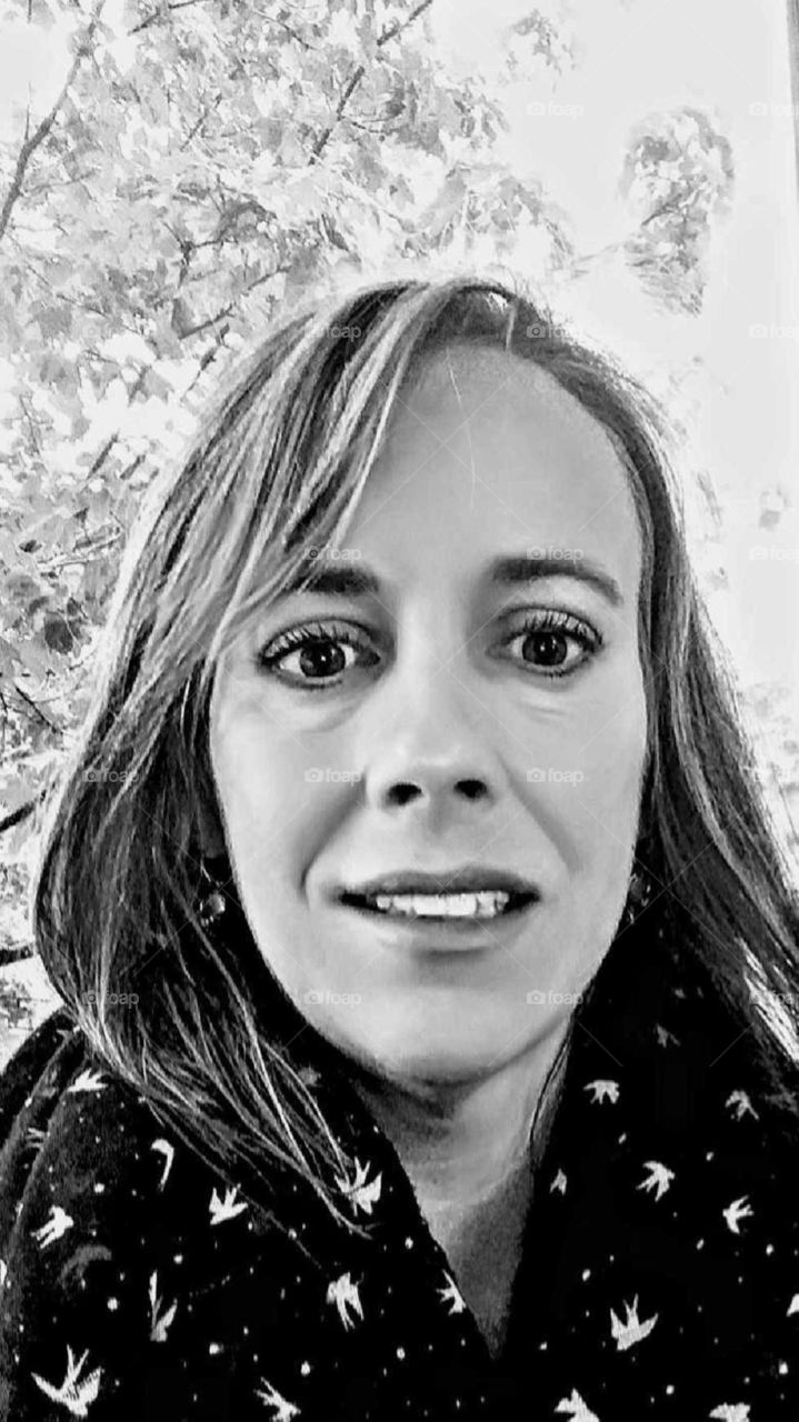 portrait of a smiling girl in black and white