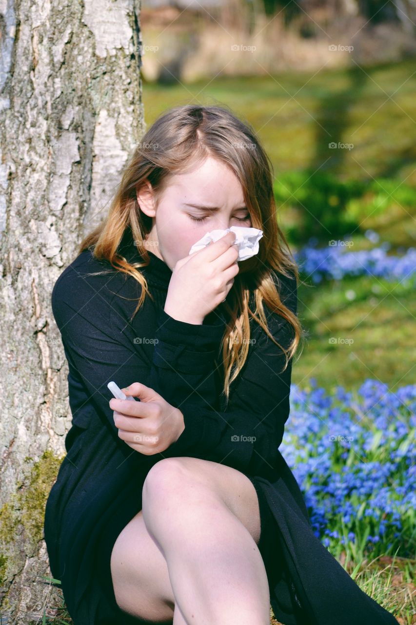 Portrait of woman sneeze