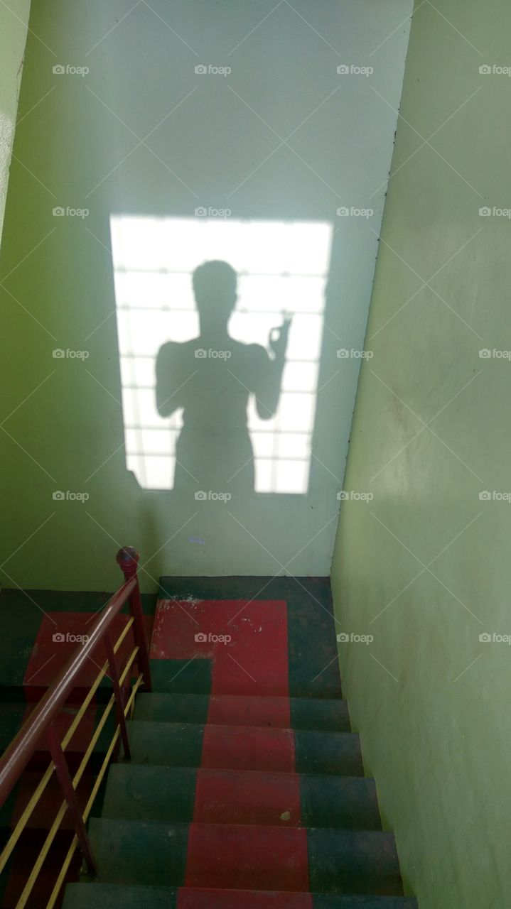 shade of man in steps 
if seems the good symble in hand