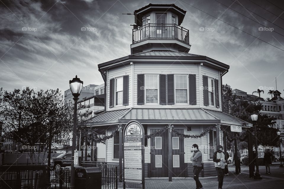 Steamboat Natchez tickets processing house. The building served as a small lighthouse long ago. Near Toulouse Station, French Quarter, New Orleans, Louisiana, USA. Monochrome version.