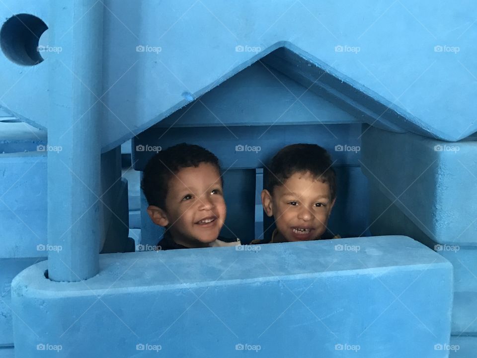 Two boys in play house at the National Building Museum 