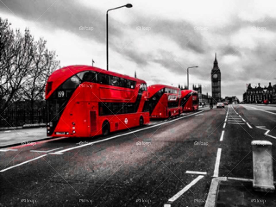 The Big Ben and red buses in London