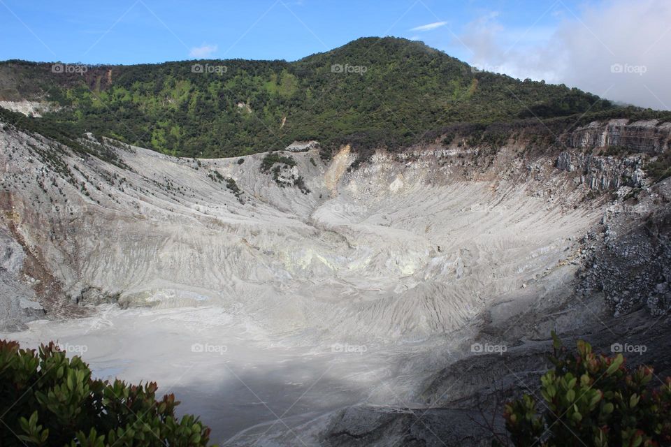 scenic view of volcanic landscape against sky