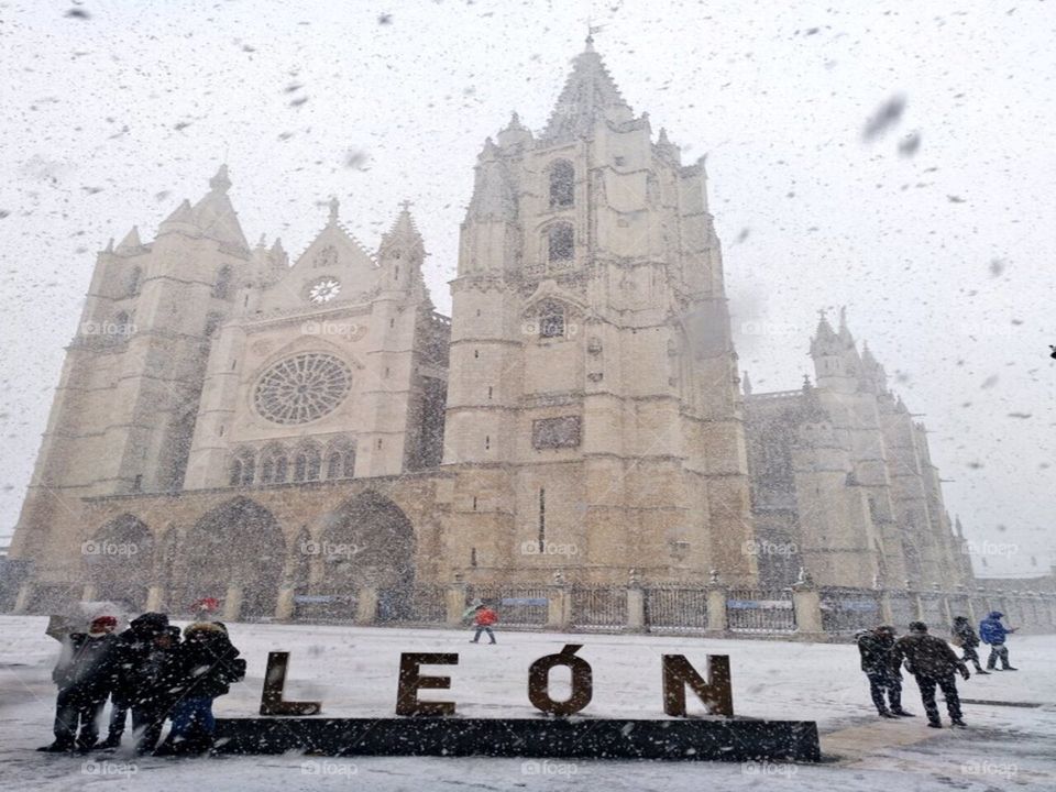 Beautiful background snow falling on the cathedral of León