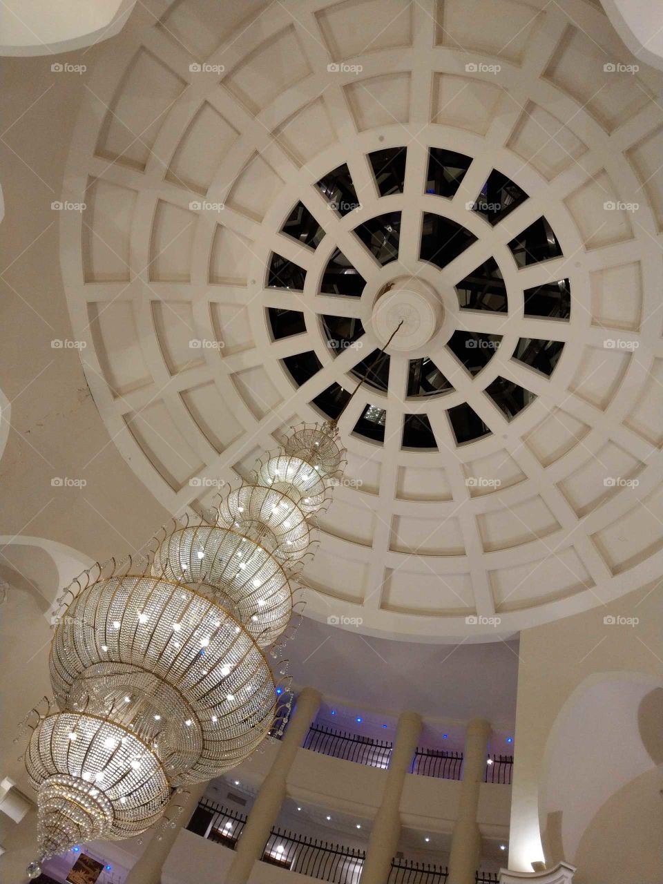Shapes: ellipse. a hotel lobby ceiling, pure color, elegant feeling.