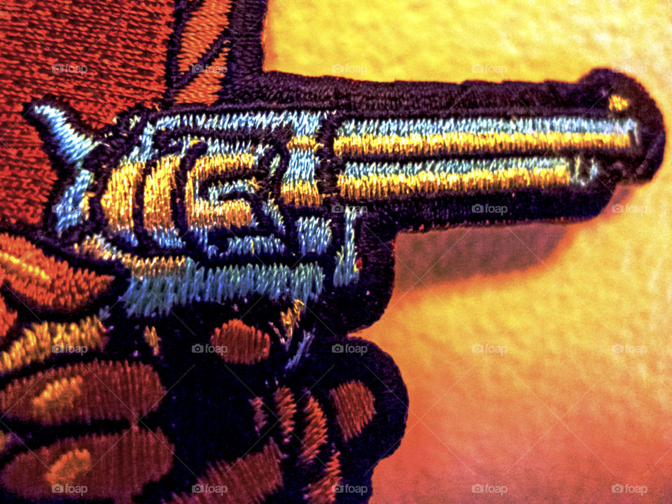 Closeup of gun sewn art