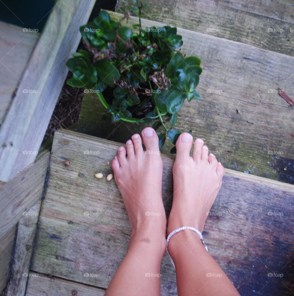 My feet and flower at the stairs