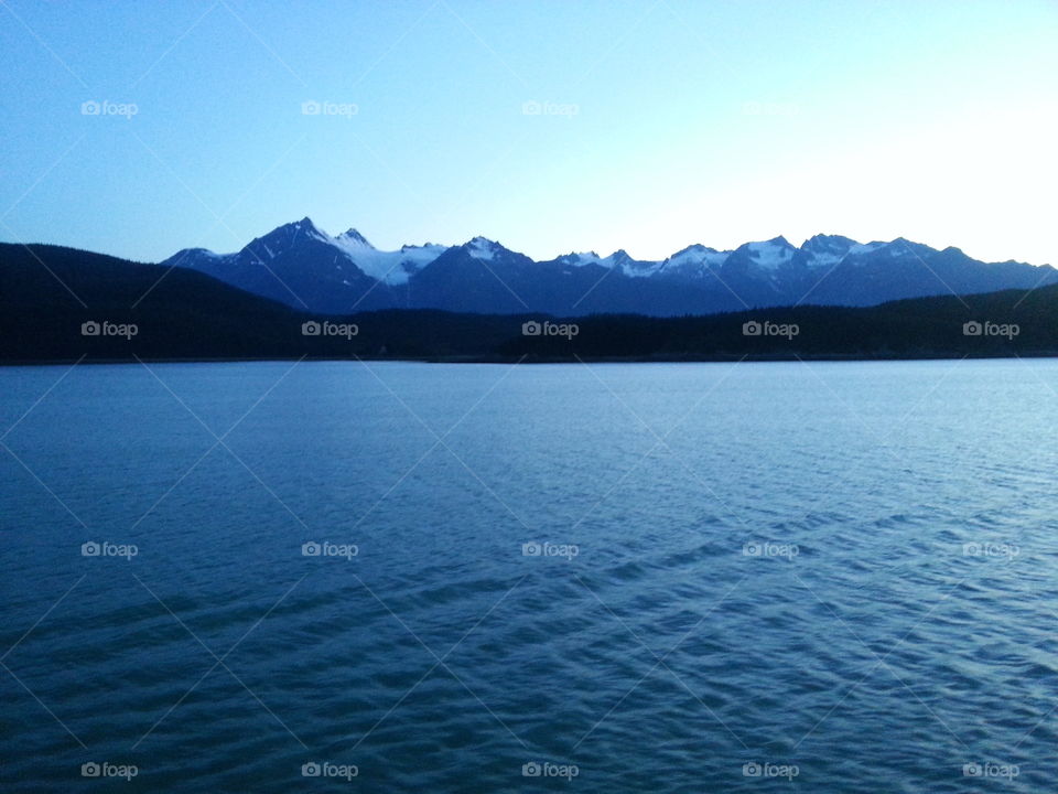 Alaska Frontier . watching the mountains go by from the beautiful Disney's Wonder Cruise ship in the waters of  Alaska