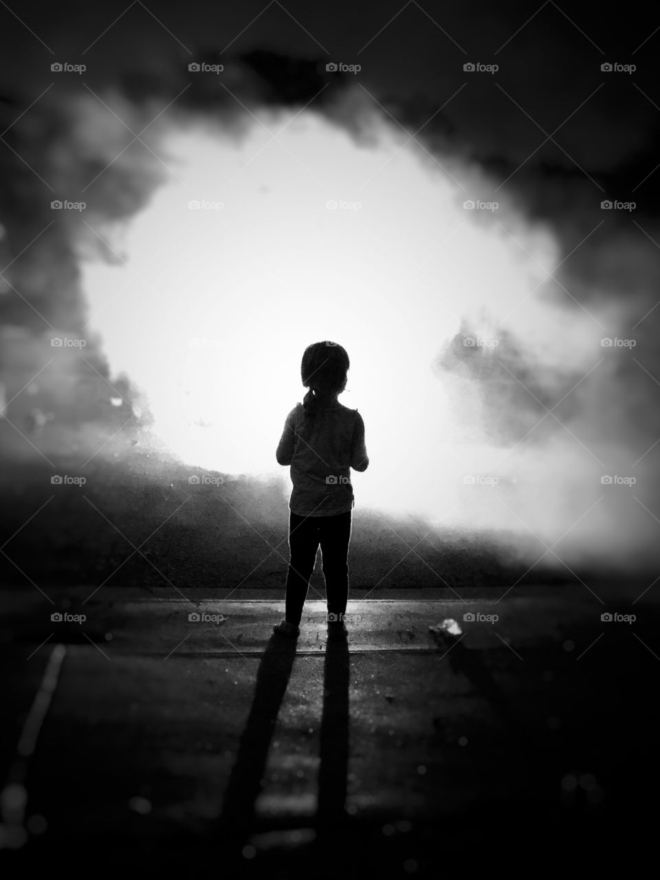 Silhouette of child watching fireworks 