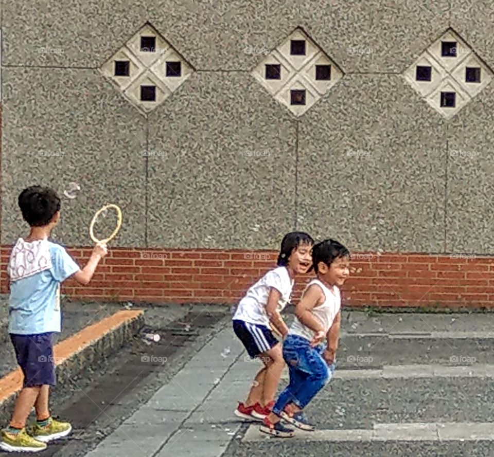 The memories of summer: playing with bubbles, children were very happy during summer vacation.