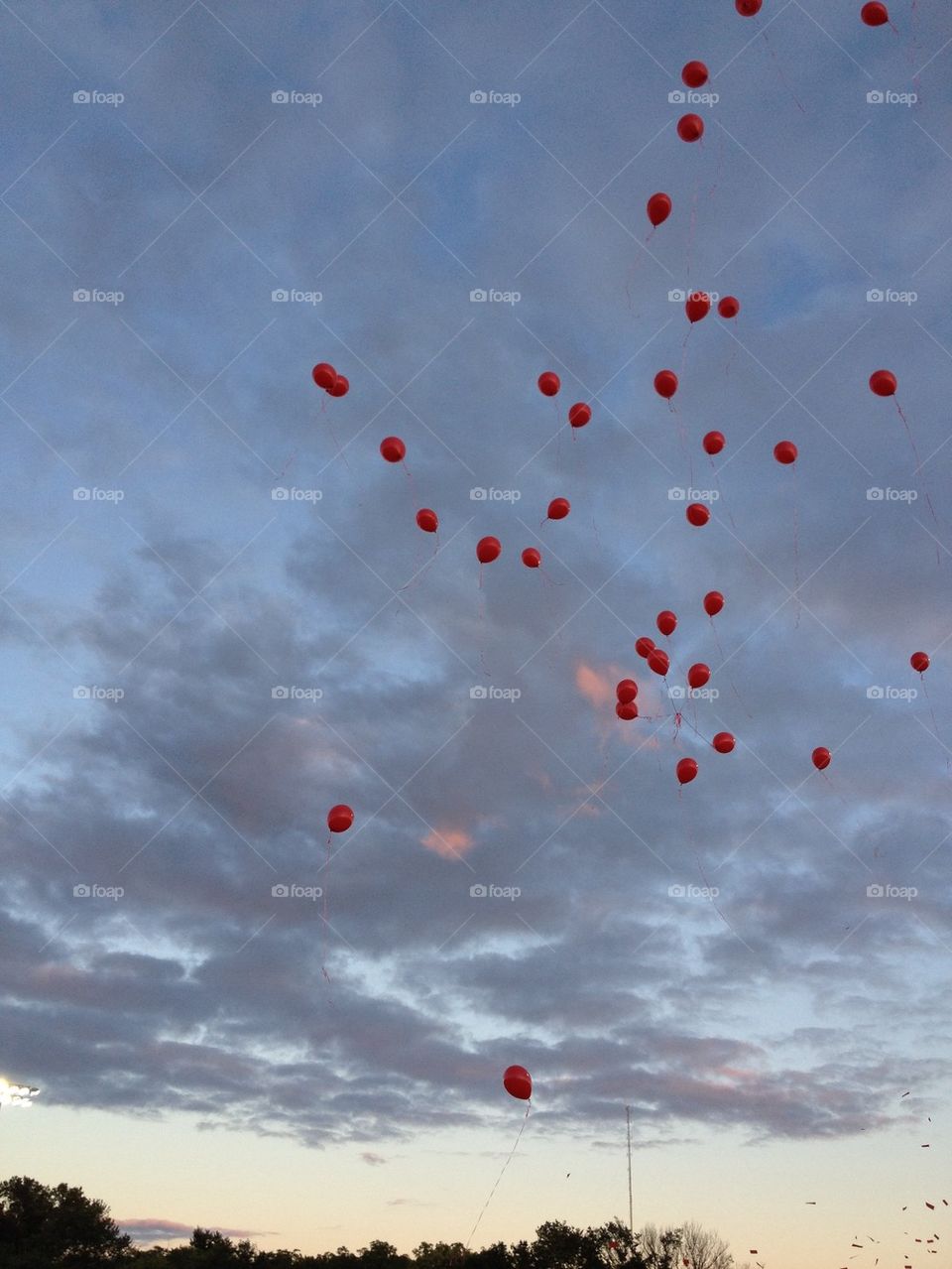 Balloons at dramatic sky