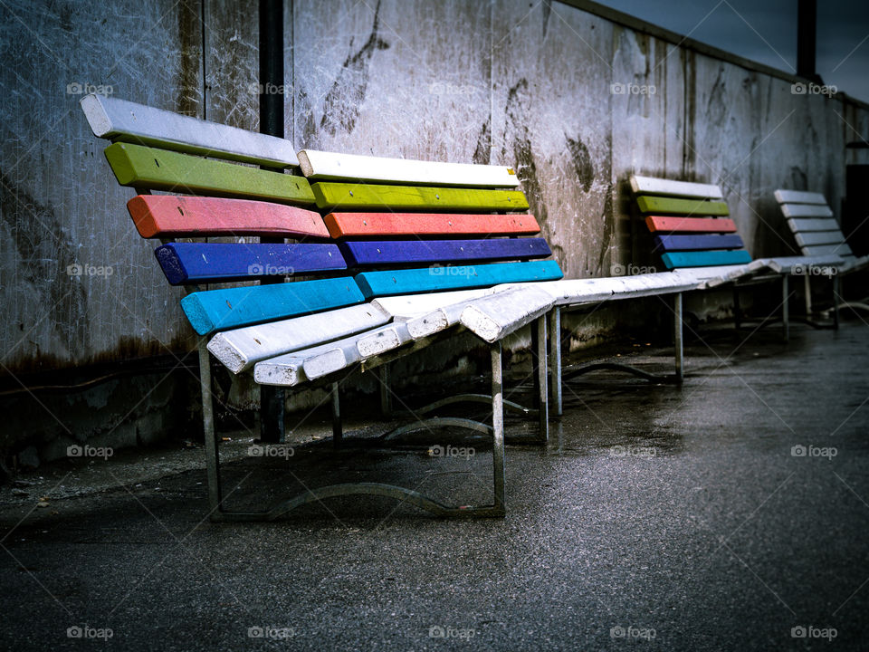 Close-up of colorful empty bench