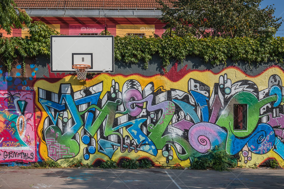 Basketball court in Ljubljana, Slovenia, with walls covered in colorful graffiti