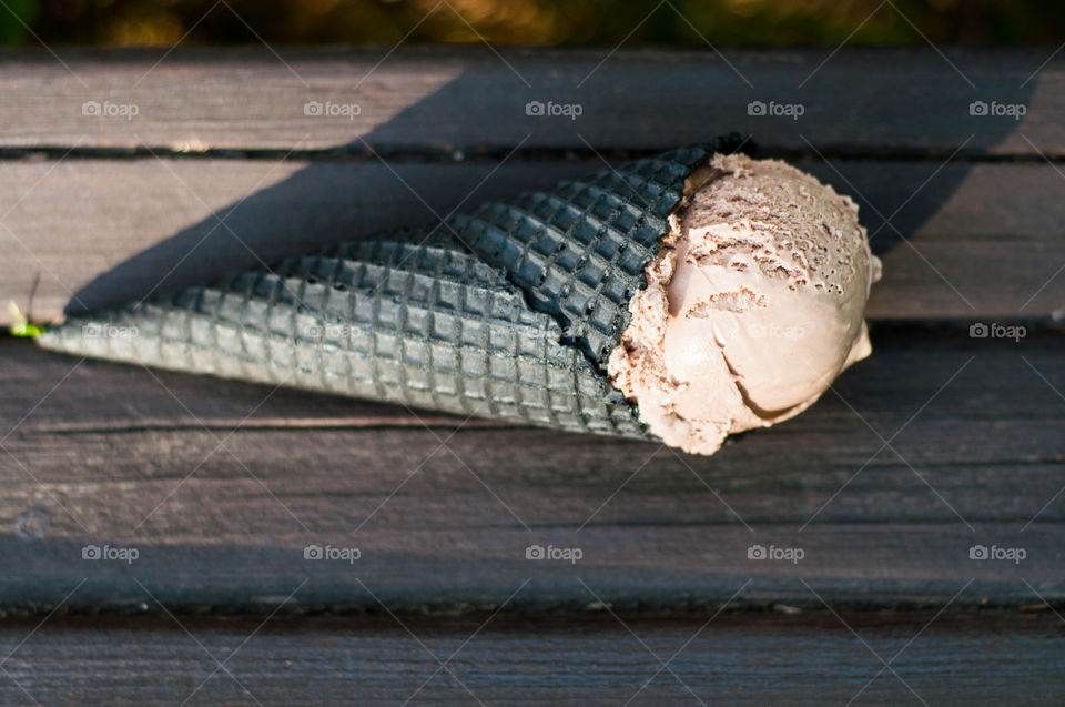 Brown ice cream on brown bench 