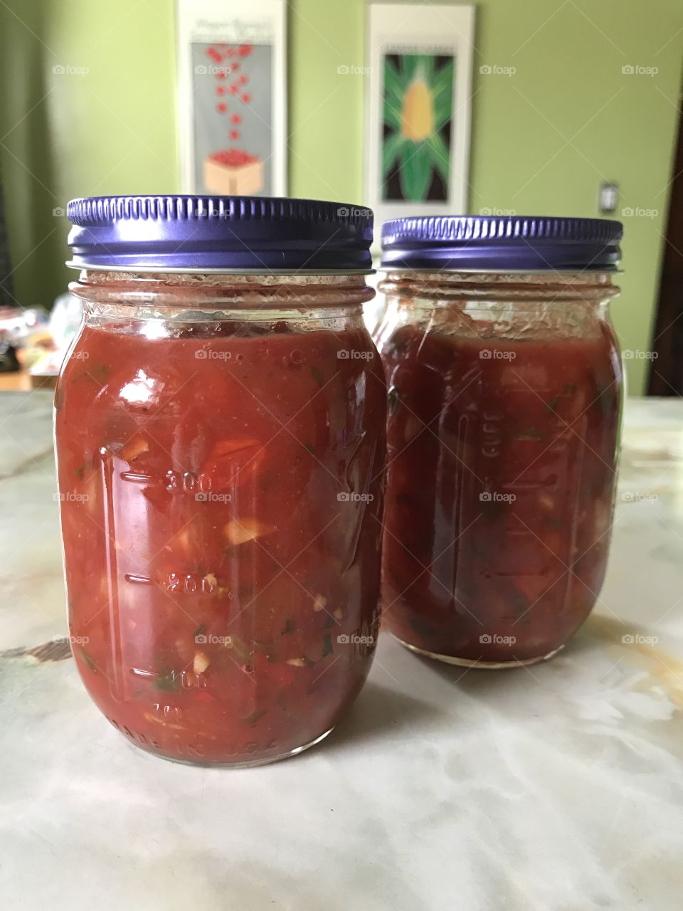 Preserving salsa made with tomatoes and peppers from our garden.