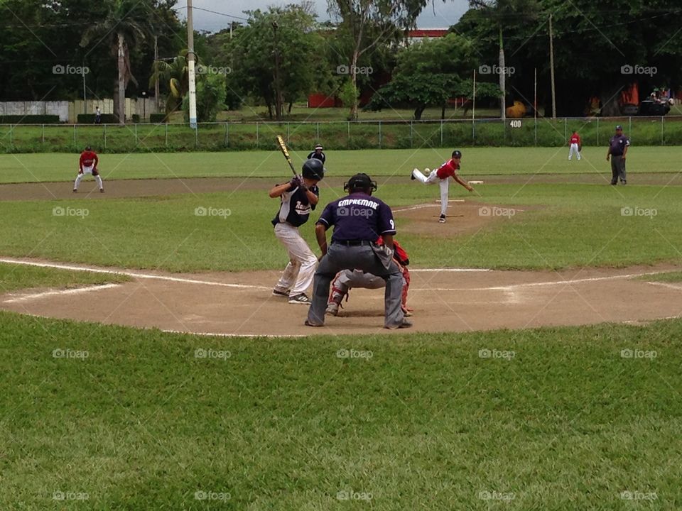 Baseball game at Jackie Robinson Stadium in Managua, Nicaragua between US and Nicaraguan youth teams. 