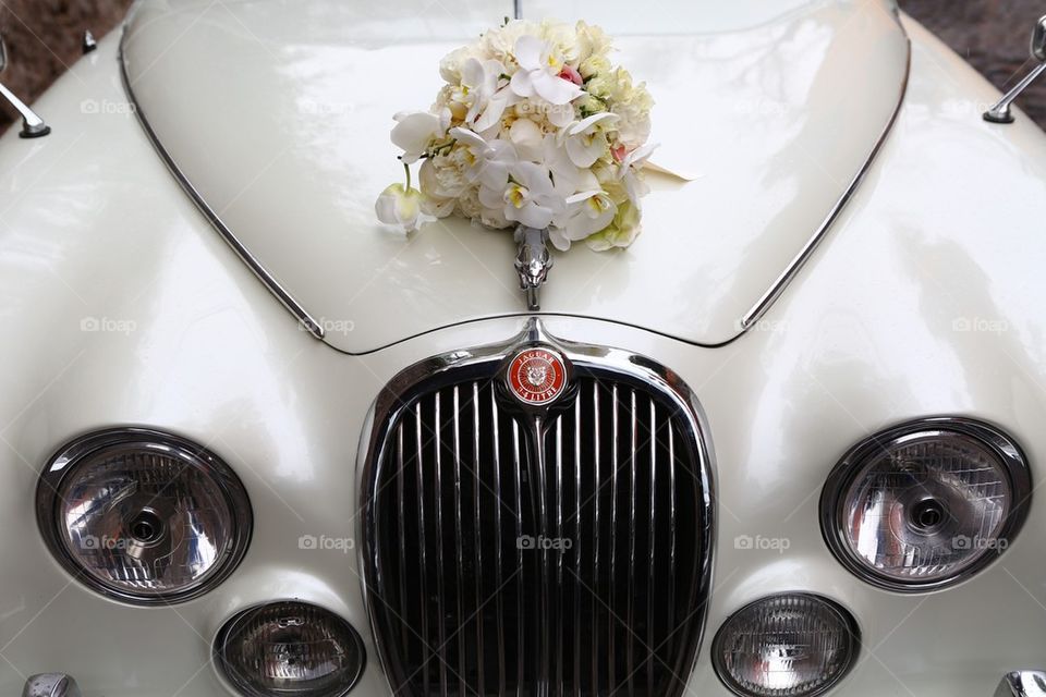 Vintage jaguar limo and flowers