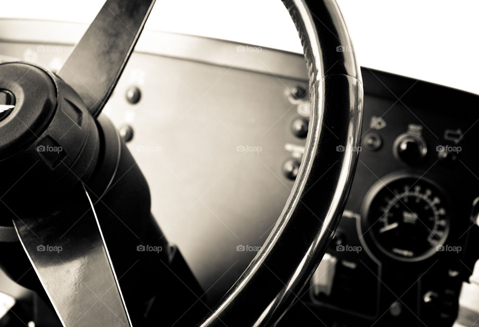 Inside the driver compartment of a transit bus. 