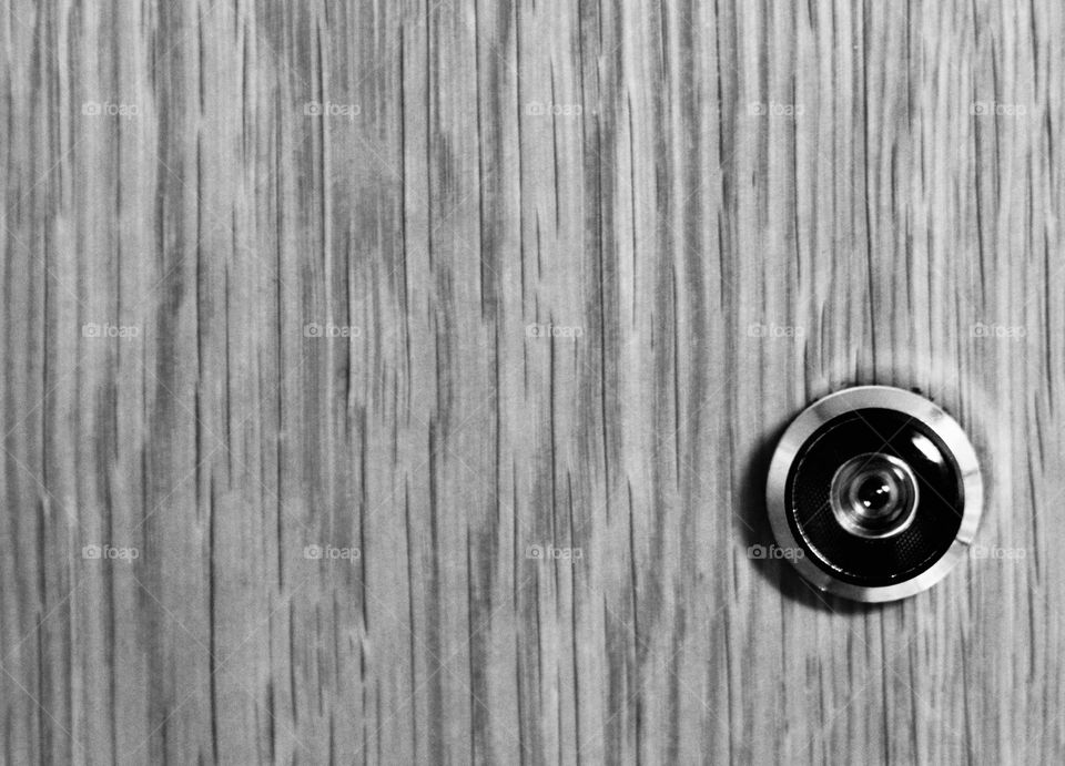 Peephole on wooden door