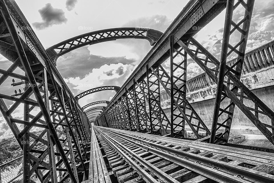 Empty railtrack against cloudy sky